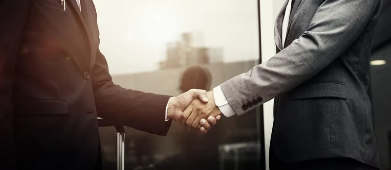Sản phẩm corporate businessmen shaking hands scaled — Công Ty Luật TNHH Khoa Tín — MST 0105957357