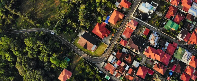 Sản phẩm aerial shot colorful buildings surrounded by trees e1675741826761 — Công Ty Luật TNHH Khoa Tín — MST 0105957357