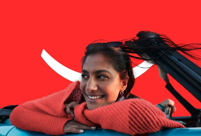 Sản phẩm smiling woman in a car — COLGATE-PALMOLIVE - Công Ty TNHH COLGATE-PALMOLIVE (Việt Nam) — MST 0300546015