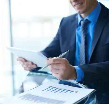 Sản phẩm businessman looking tablet e1726625896710 — Công Ty TNHH Một Thành Viên Thương Mại Dịch Vụ In Bao Bì Cuộc Sống Mới — MST 0305918443