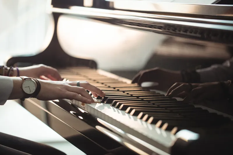 Sản phẩm woman playing piano scaled — Công Ty TNHH C-Fly Music — MST 0315904538