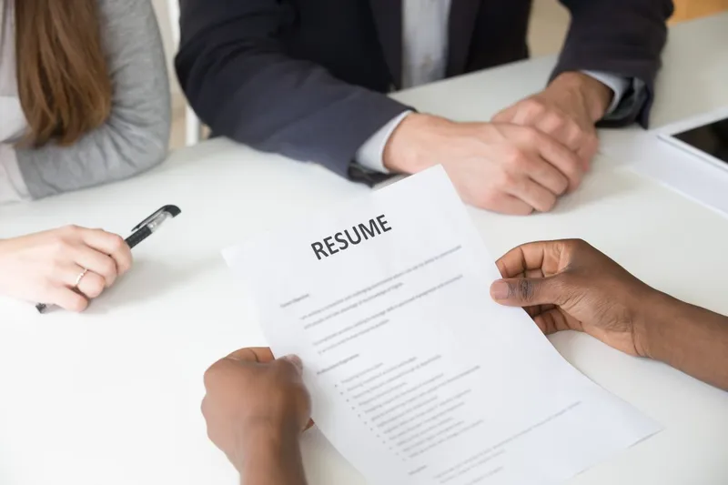 Sản phẩm african american applicant holding resume job interview close up view 1200x800 — Công Ty TNHH HR Dept. Việt Nam — MST 0316583686