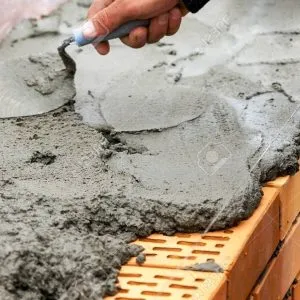 Sản phẩm 130993636 brickwork hand with a trowel cement mortar red brick  300x300 — Công Ty CP Tập Đoàn Hoành Sơn — MST 3000244065